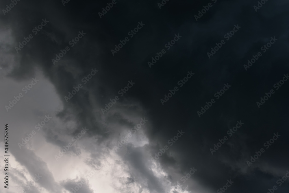 Dark sky and a sharp black cloud before the rain Dark sky and a sharp black cloud before the rain