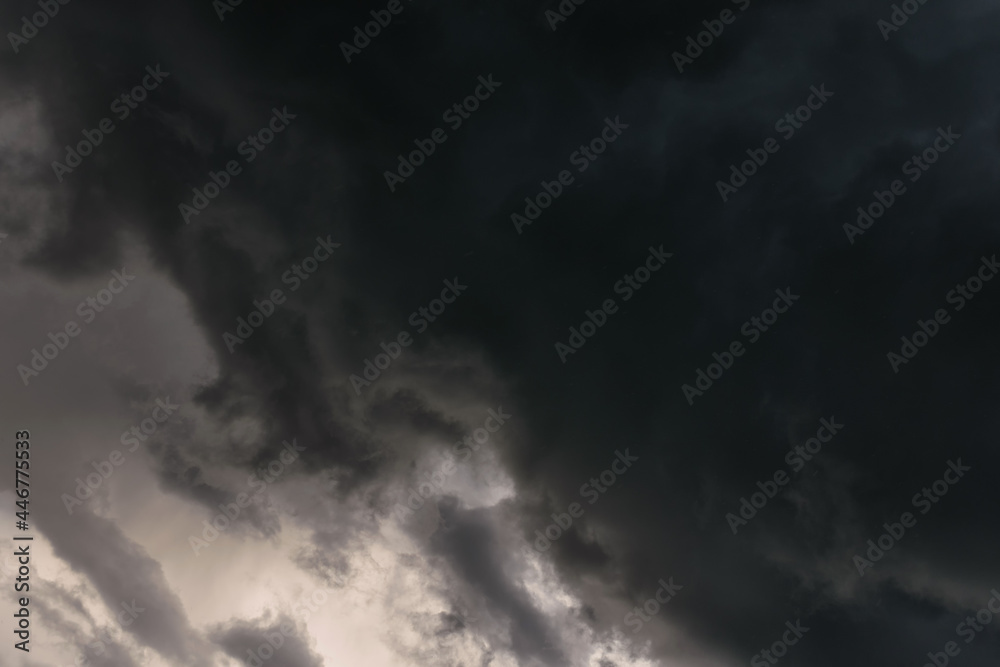 Dark sky and a sharp black cloud before the rain