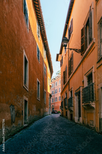 A narrow ancient alley with cobblestone in the historic center of Rome © Dmytro Surkov