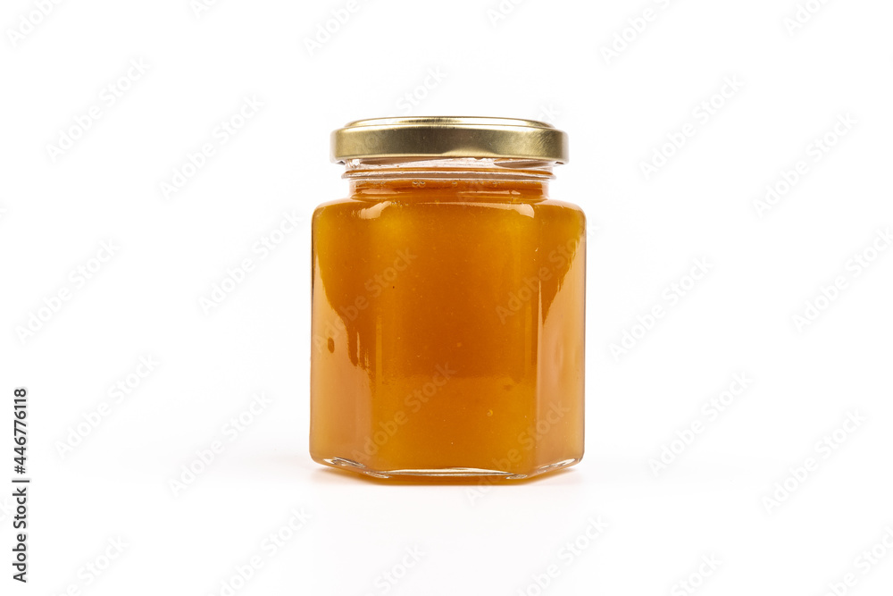 Glass jar full of sweet honey isolated on white background Glass jar full of sweet honey isolated on white background