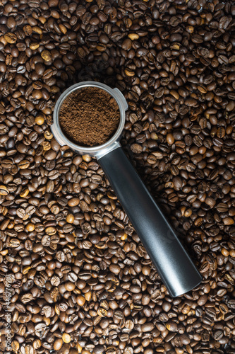 Coffee beans and coffee horn with ground coffee
