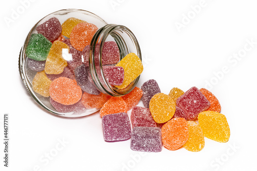 Candy Jar isolated on a white background, colorful soft jubes, sugary lollies. Delicious lollies, healthy eating.