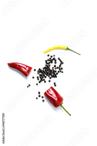 red hot peppers and dried peppercorns on a white background