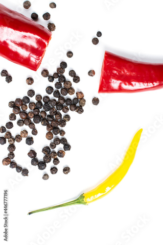 red hot peppers and dried peppercorns on a white background