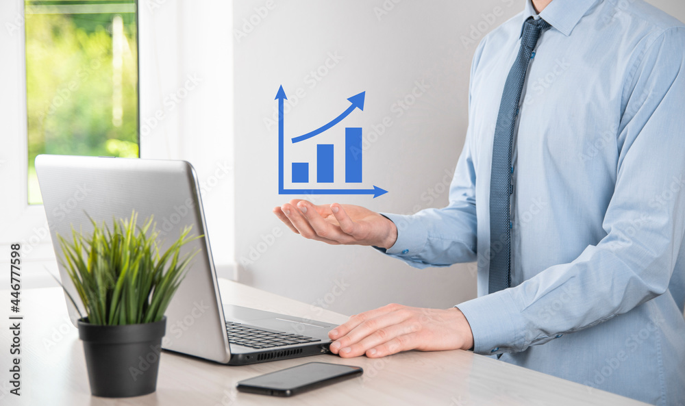 Business man holding holographic graphs and stock market statistics gain profits. Concept of growth planning and business strategy. Display of good economy form digital screen. Business man holding holographic graphs and stock market statistics gain profits. Concept of growth planning and business strategy. Display of good economy form digital screen.
