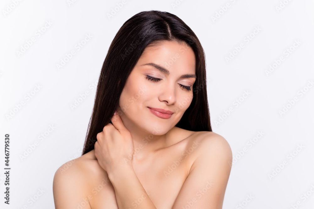 Photo portrait woman smiling dreamy touching neck body pampering isolated white color background