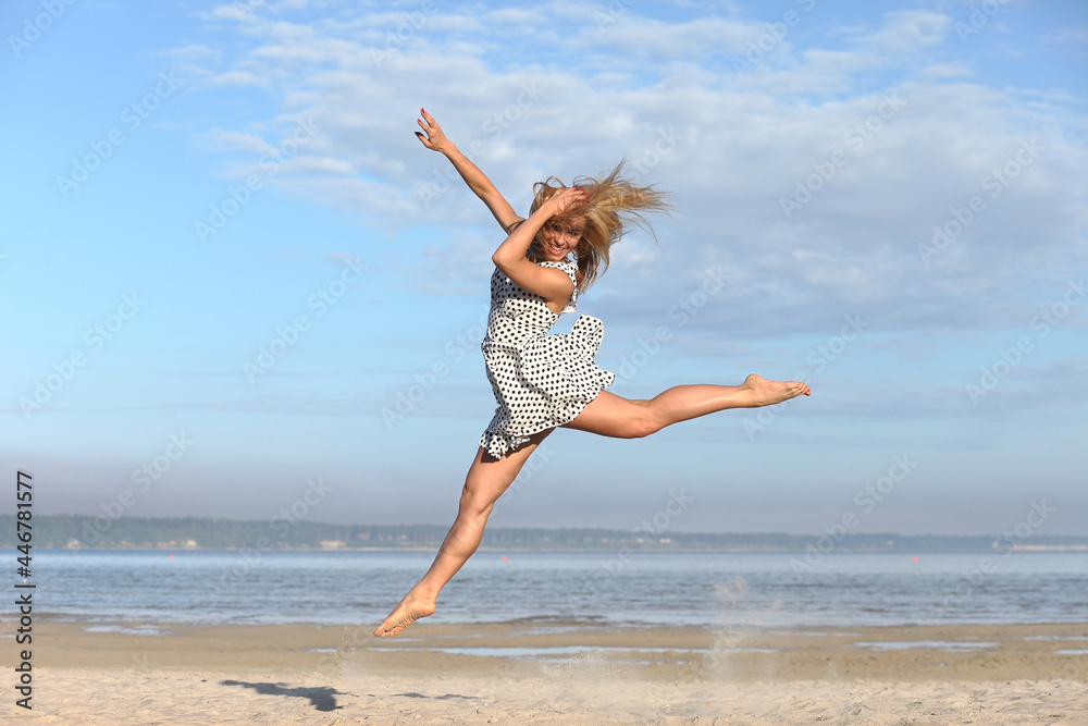 young woman in red dress on the beach young woman in red dress on the beach