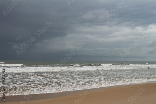 Shocking and beautiful storm clouds on the sea coast. Dark colored clouds in the sky.