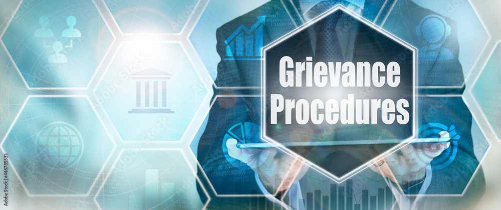 A Grievance Procedures business word concept on a futuristic blue display.
