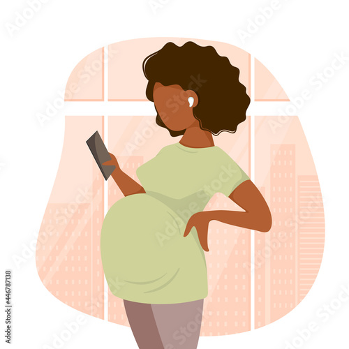 Cute cartoon dark skinned pregnant woman in pants and t-shirt listens to music with headphones holds a phone in her hand against the backdrop of the city's metropolis. Flat style. Vector illustration.