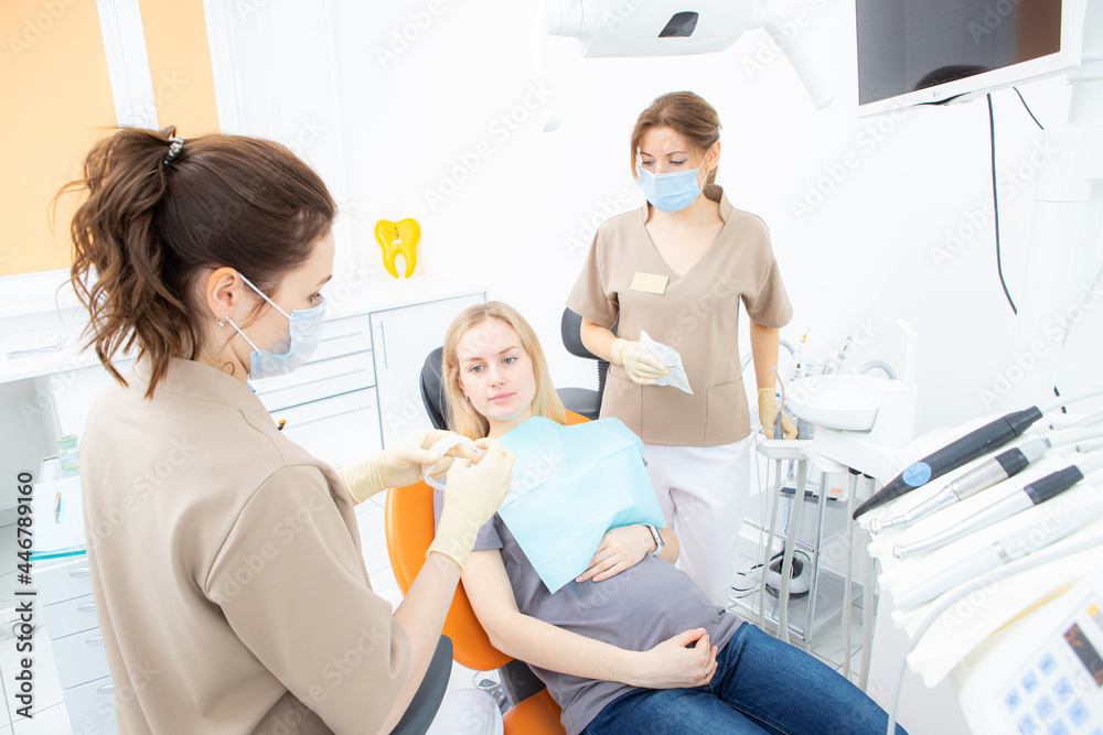 pregnant woman at the dentist's office, checkup and dental treatment for pregnant women. pregnant woman at the dentist's office, checkup and dental treatment for pregnant women.