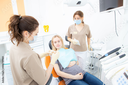 pregnant woman at the dentist s office  checkup and dental treatment for pregnant women.