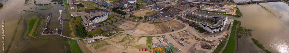 Empty lot PUUR21 wide panoramic view on new housing construction project part of urban development plan Noorderhaven neighbourhood during high water level of river IJssel