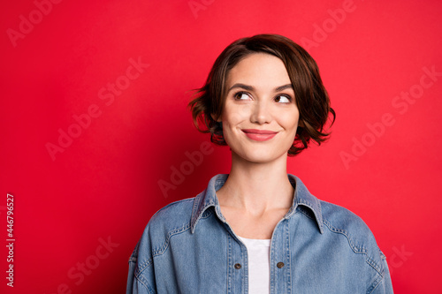 Photo of sweet bob hairdo young lady look empty space wear jeans shirt isolated on red color background