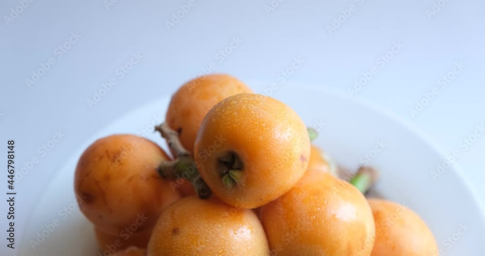 loquat or Eriobotrya japonica. whole ripe loquat fruits on white background loquat or Eriobotrya japonica. whole ripe loquat fruits on white background