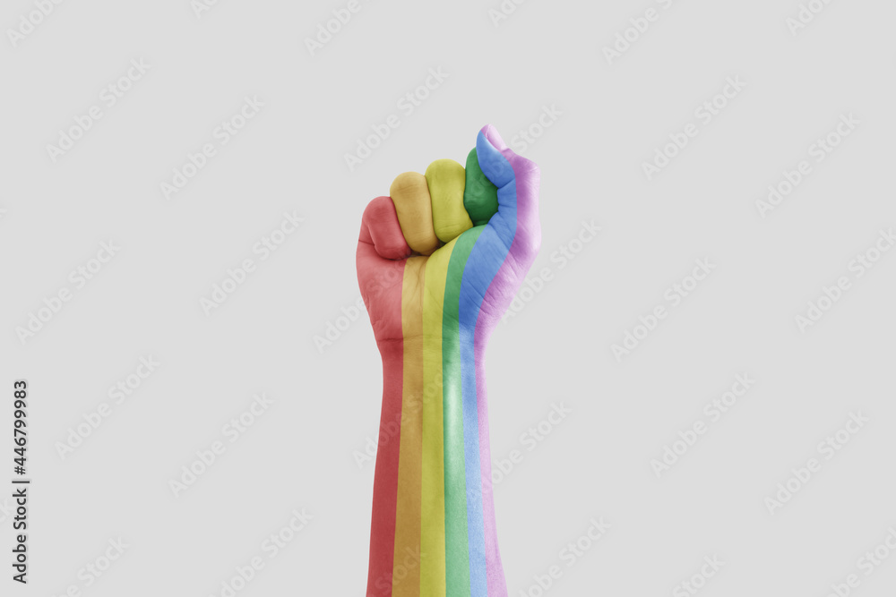 Hand raised. Rainbow pride colors, isolated on white background Hand raised. Rainbow pride colors, isolated on white background