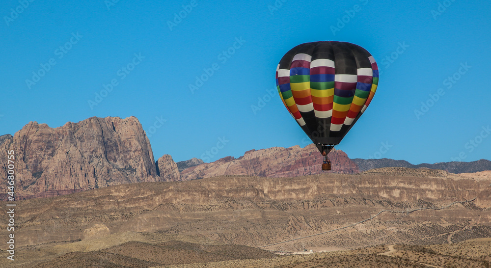Hot Air Balloon as it lands with Las Vegas mountains in the background.