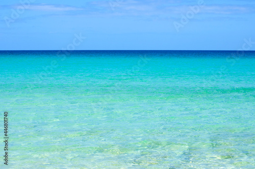 View of the horizon and transparent, sparkling blue ocean water in different shades. Atlantic ocean, Canary islands. © Victoria