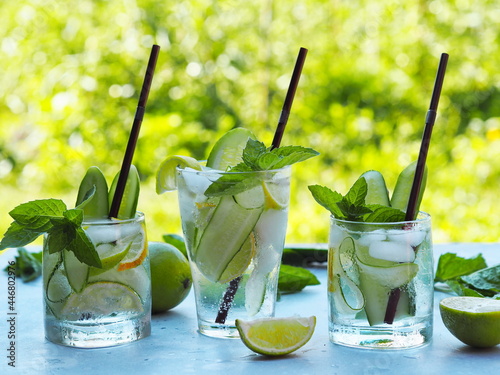 A natural drink with ice, cucumber, lemon and lime to cool in the heat. Summer drink.