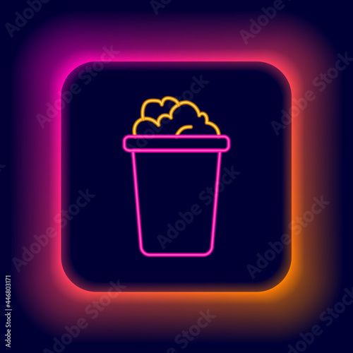 Glowing neon line Bucket with soap suds icon isolated on black background. Bowl with water. Washing clothes, cleaning equipment. Colorful outline concept. Vector