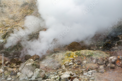 Thrilling view of volcanic landscape, aggressive hot spring, erupting fumarole, gas-steam activity in crater active volcano. Amazing mountain landscape, travel destinations for hike, active vacation.