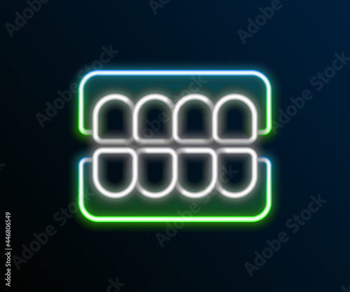 Glowing neon line False jaw icon isolated on black background. Dental jaw or dentures, false teeth with incisors. Colorful outline concept. Vector