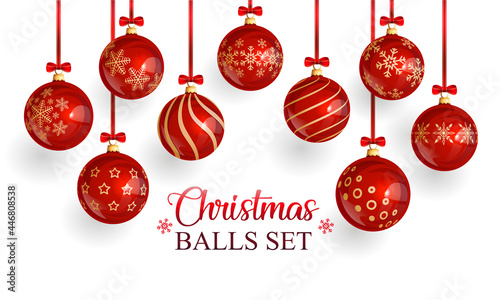Realistic Christmas red glass balls  with snowflake pattern and christmas ornament suspended on red bows with red ribbons. Beautiful christmas background.