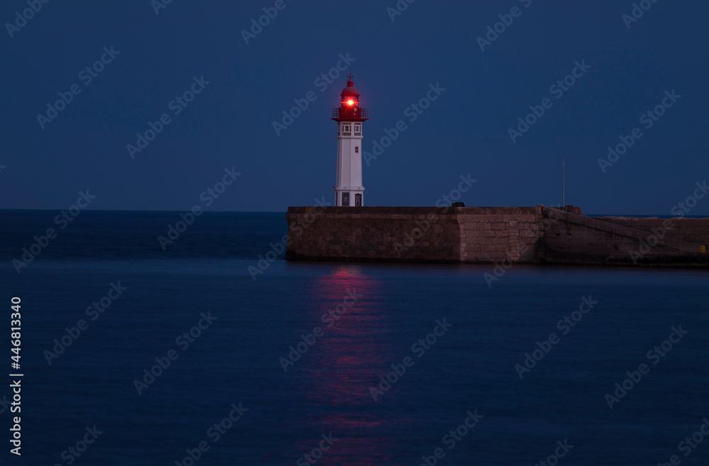 A Lighthouse with red light at night, Almeria, Spain