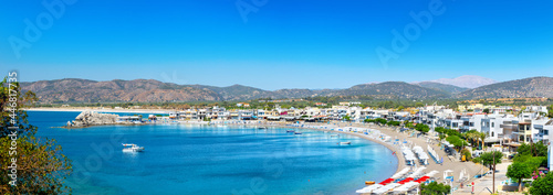 Crystal clear turquoise water in a bay. Charaki in the past small fishing village on the east coast of the island of Rhodes now an beach resort. Vacation on Greece islands in and Mediterranean sea.