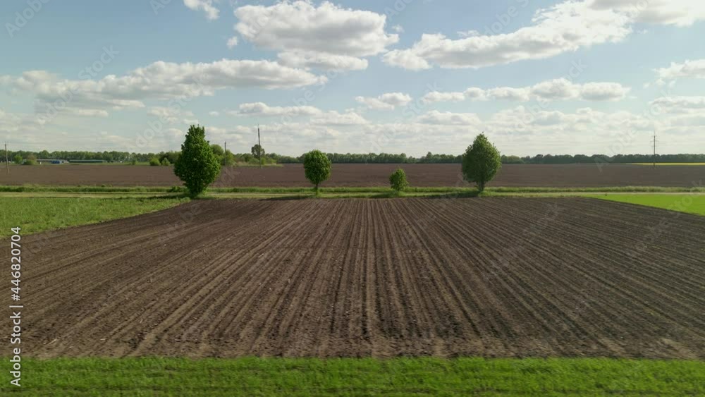 Agriculture Farm fields growing in nature,Plow Ground, Soil For Sowing, Aerial low angle flight. Agriculture Farm fields growing in nature,Plow Ground, Soil For Sowing, Aerial low angle flight.