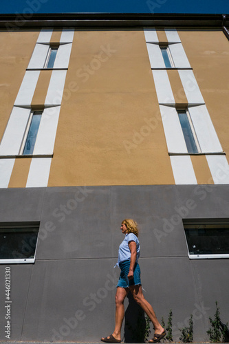 Photography Stockholm, Sweden  A woman walking on Vattenledningsvagen in Midsommarkransen