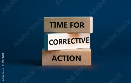 Time for corrective action symbol. Wooden blocks with words 'Time for corrective action' on a beautiful grey background. Business, time for corrective action concept. Copy space. photo