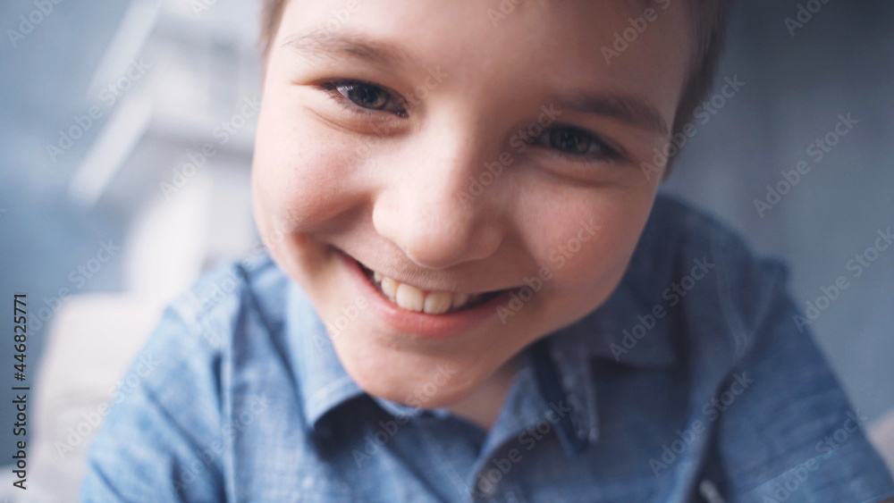 child plays on the phone, view from the phone, emotion joy of victory child plays on the phone, view from the phone, emotion joy of victory