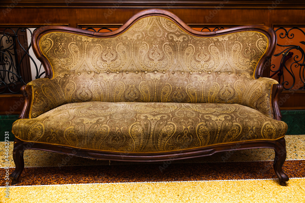 Antique, medieval, soft sofa in the living room. foto de Stock | Adobe Stock