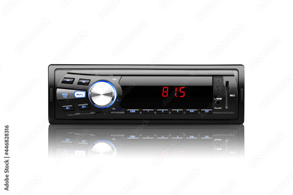 Front view of a black automobile radio with screen on with silver button on white background with reflection underneath Front view of a black automobile radio with screen on with silver button on white background with reflection underneath