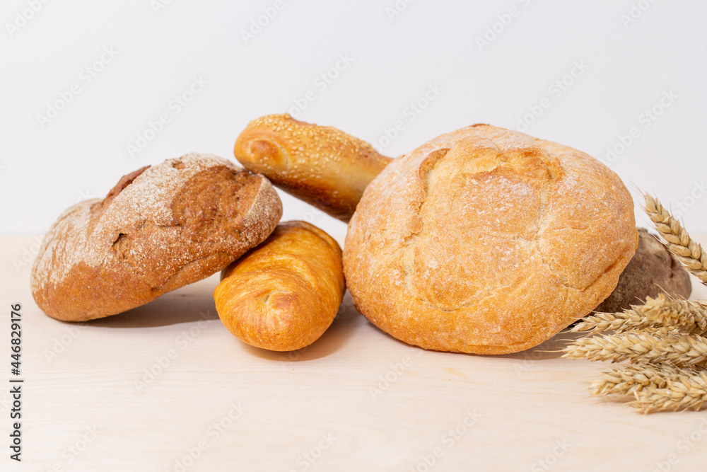 loaf of bread and wheat, assortment of bread