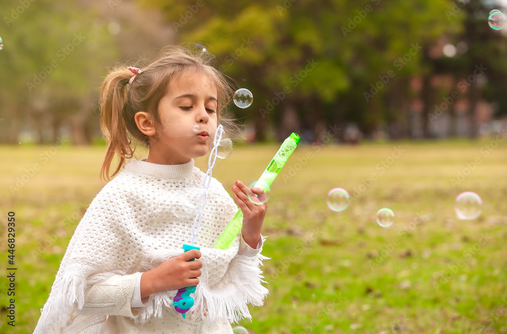 happy girl with soap bubbles