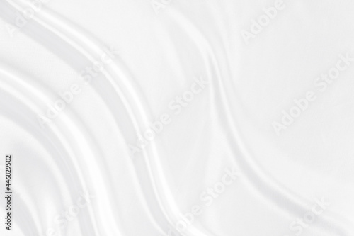 White gray satin texture that is white silver fabric silk background with beautiful soft blur pattern natural.