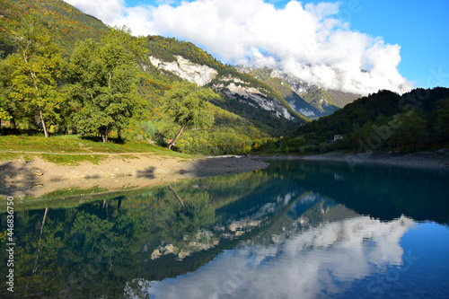Fototapeta Naklejka Na Ścianę i Meble -  Lago di Tenno with its clear turquoise water in the morning light. Trentino, Italy.