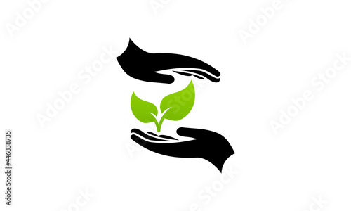 Plant growth between two hands eco symbol