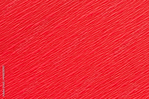 Detail of a red crepe paper crinkly texture