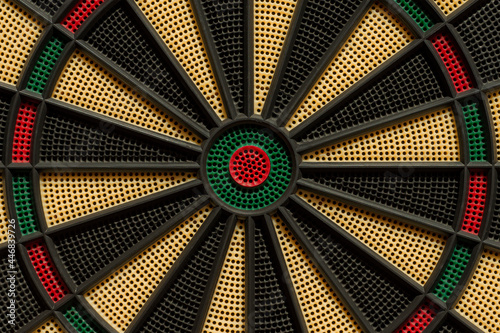 Dartboard with its circular shape and concentric rings