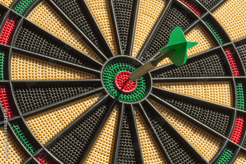Single dart on the target (bullseye). Success concept