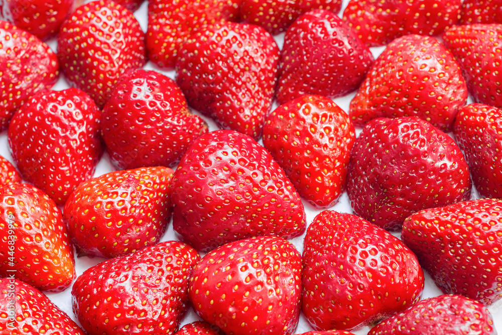 Full frame of fresh and juicy strawberry halves Full frame of fresh and juicy strawberry halves