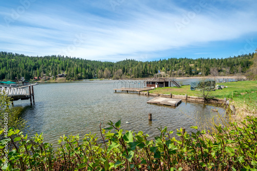 A small boat dock and boathouse along the shores of Lake Coeur d'Alene at Rockford Bay, in Coeur d'Alene, Idaho USA.