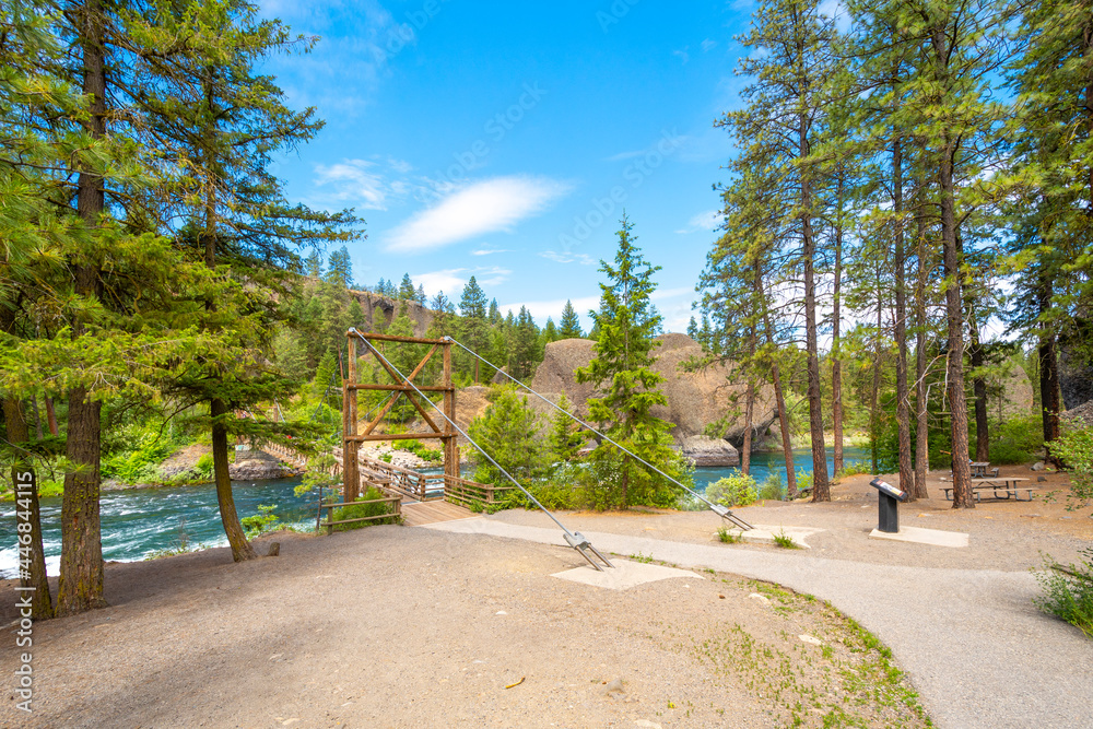 The wooden suspension bridge over the Spokane River at the Bowl and Pitcher area of Riverside State Park in Spokane, Washington, USA The wooden suspension bridge over the Spokane River at the Bowl and Pitcher area of Riverside State Park in Spokane, Washington, USA