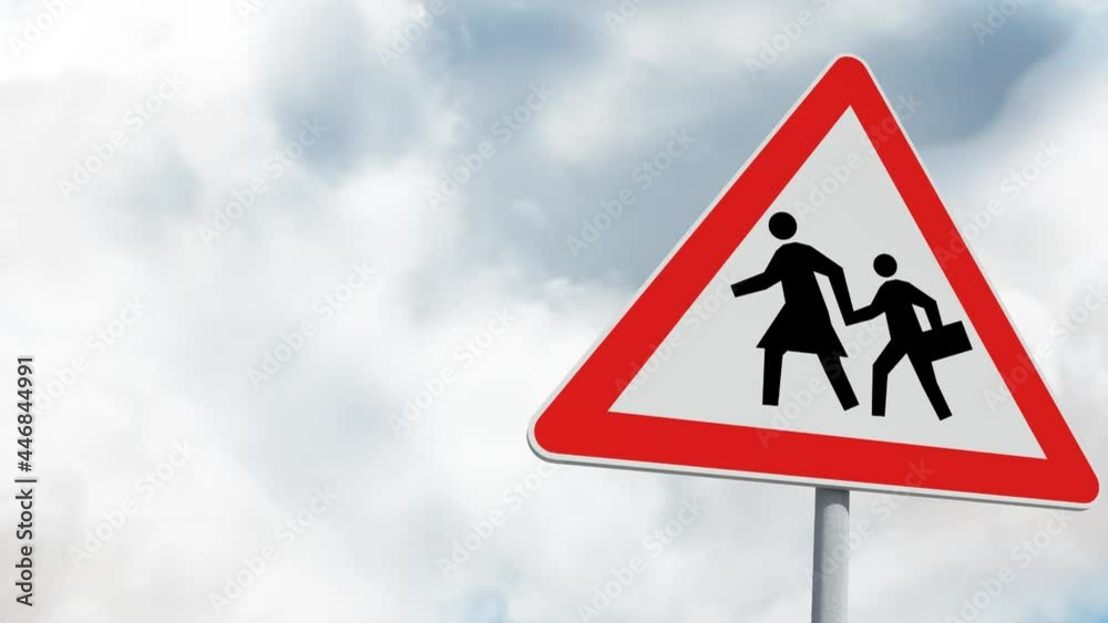 Pedestrian crossing sign board post against clouds in the blue sky Pedestrian crossing sign board post against clouds in the blue sky