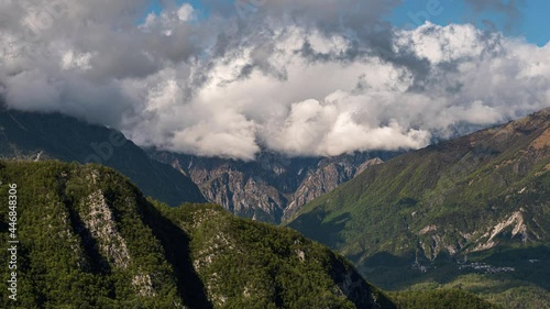 Mountain landscape with clouds formation over the ridges. North east Italy, Prealpi Giulie - Julian Prealps