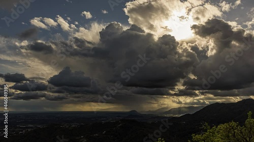 Dramatic cloudscape over plain and mountains of north east Italy, Friuli.