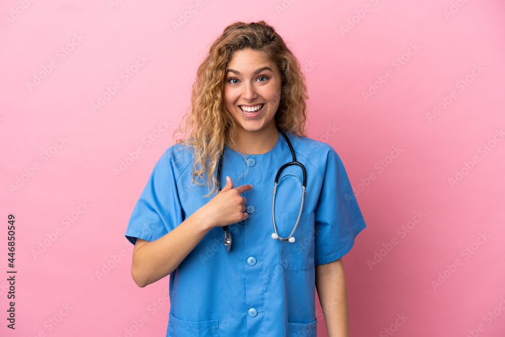 Young surgeon doctor woman isolated on pink background with surprise facial expression Young surgeon doctor woman isolated on pink background with surprise facial expression
